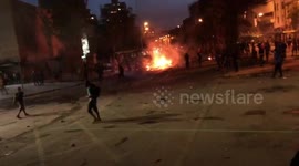 Anti-government demonstrators shine laser pointers at police during clashes in Santiago, Chile