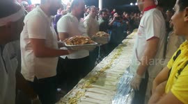 Chefs Putting Large Amount Of Chicken Shawerma In Longest Free Sandwich Event