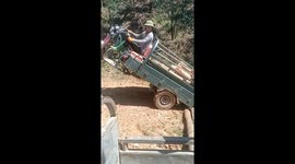 The man demonstrated a special skill when riding a tricycle to move wooden blocks to the ground