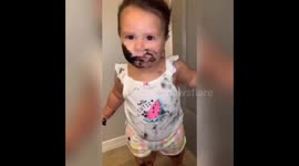 Hilarious moment ‘hooligan baby’ decorates herself with her mother's mascara