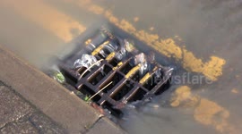Mesmerising footage captures water flowing down a drain during floods in Tewkesbury