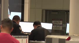 tsa checkpoint terminal 1 women with a firearm in her luggage perp walk lax airport police