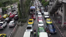 Scary crazy traffic scares a young child in Bangkok.