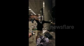 Man practices firing arrows at Hong Kong Polytechnic University amid clashes