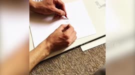 Ambidextrous artist creates quirky alien drawing with both hands