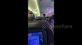 Man on plane realises his 'Battleship' opponent is sitting IN FRONT OF HIM on flight to Florida