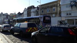 city traffic causing air pollution in Bristol and people breathing polluted air