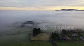Atmospheric drone footage captures dense fog over Northern Ireland