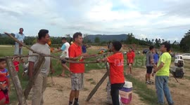 Children take part in bird therapy event with Brazilian Macaws in southern Thailand