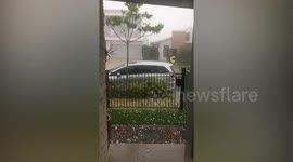 Golf ball-size hail stones hit town in Queensland leaving homes damaged