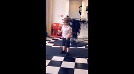Darby age 4 waiting in the barbers for a haircut gets up and dances to favourite song, so funny and cute!