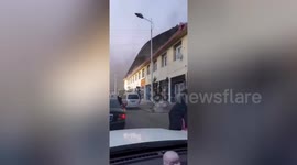 Powerful winds rip off building's roof in north China