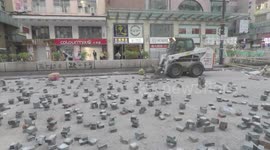 Hong Kong residents clear up roadblocks after night of protests