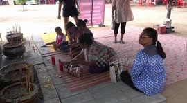Superstitious locals worship tree trunk to choose their next lottery numbers