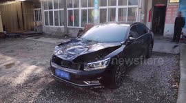 Flying tire smashes car's hood after falling off truck in China