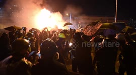 Further footage shows Hong Kong activists unleashing barrage of missiles onto armoured vehicle