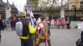 A long line of Brexit protestors at Parliament slow motion