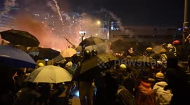 Journalist hit in the head with tear gas canister by Hong Kong police during skirmish with protesters