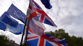Brexit Union Jack and EU flags slow motion