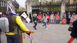 Brexiteer talking to the crowds outside Parliament slow motion