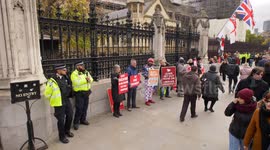 Brexiteers and Union Jack flag outside Parliament