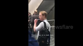 Man doing his teeth at Euston train station