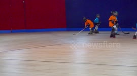 Little Boy falls during Roller Hockey