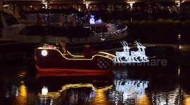 Santa sails into London to turn on Christmas lights
