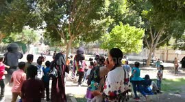 School Boys Followed Cartoon Clowns In Park
