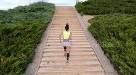 Girl running up the stairs in the park