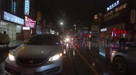 Dark rainy night in the streets of Toronto making for low visibility as temperatures warm up after recent record cold and snow