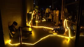 Visitors enjoy colourful interactive light show in Bangkok