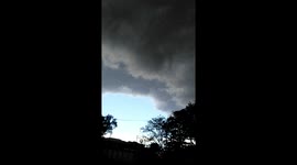 Storm clouds Johannesburg South could this be part of the tornado at Durban moving inland.. South Africa? Weather getting Viral... You can see the big grey clouds moving over the whit cloud's.. Dark grey huge clouds cover the sky.. Winds pick up.