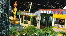 miniature ship from used wood and archway from ecobrick in Padang city