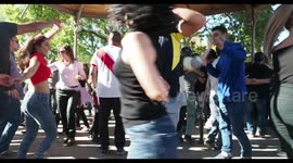 people enjoying latin salsa dancing in parc de la cuitadella, barcelona