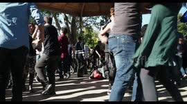 people enjoying latin salsa dancing in parc de la cuitadella, barcelona