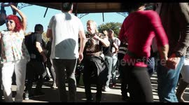 people enjoying latin salsa dancing in parc de la cuitadella, barcelona