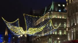 Spirit of Christmas golden angels lights sparkle over Oxford Circus - London by night