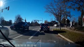 Red light runner crashes into left turning traffic