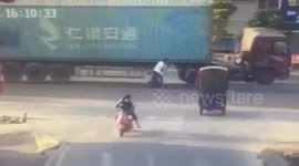 Chinese biker knocked down by oncoming overturning truck