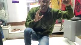 Writhing baby cobra rescued from clothing store in southern India