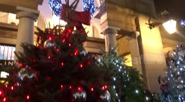 Entrance to Covent Garden Market is sparkling with a circle of Christmas Trees