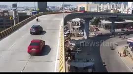 New footage shows moment speeding car plummets off flyover into crowd in India