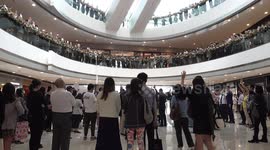 Hong Kong pro-democracy protesters stage peaceful protest inside shopping mall