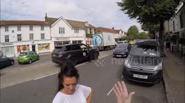 'You're not normal!' Raging motorist confronts cyclist that catches her on phone