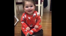 Zoë riding the vacuum