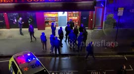 Heavily armed police gather on Roman Road