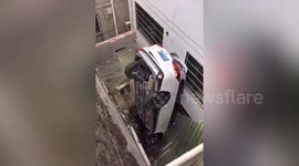 Car ends up on house roof after smashing through guardrails in China
