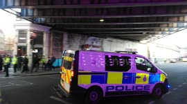 Numerous police vehicles rush to London Bridge where one person shot and several injured