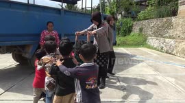 Indonesian police women treat traumatized children of natural disaster victims